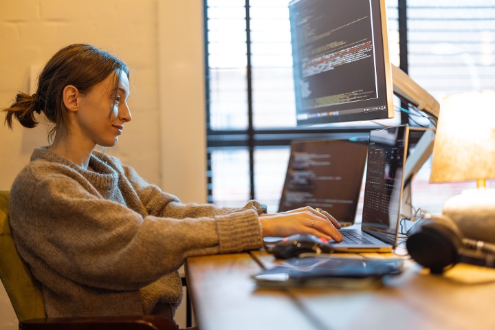 Female web developer using her technical skills for web development