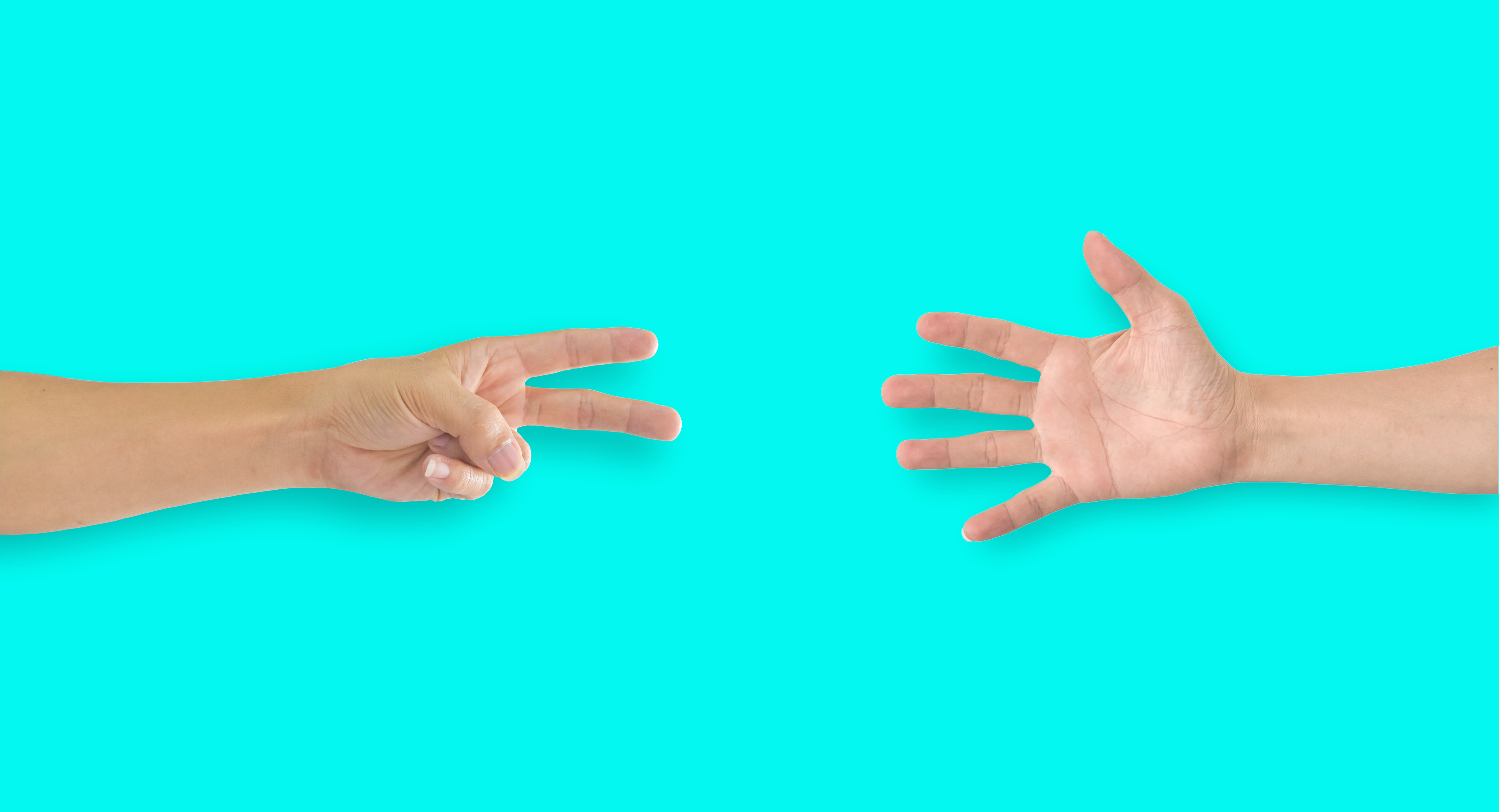 two hands playing rock, paper, scissors 